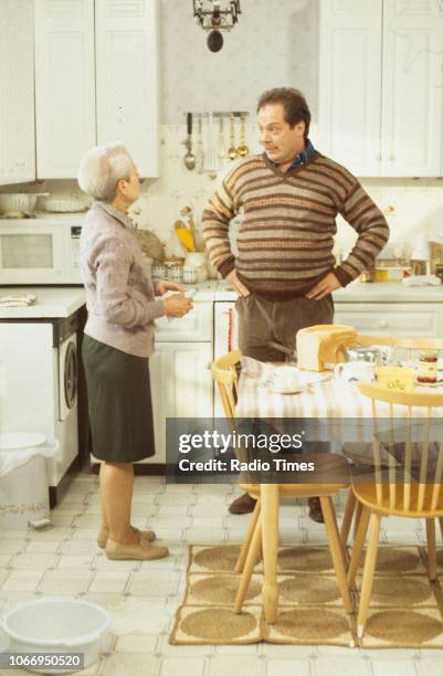 Actors Annette Crosbie and Owen Brenman in a kitchen scene from the Christmas special episode 'Starbound' of the BBC Television sitcom 'One Foot in...