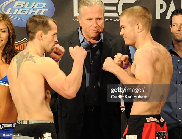 Bantamweights Clint Godfrey & Michael McDonald face off as WEC GM Reed Harris looks on at the WEC 52 weigh-in at the Palms Hotel and Casino on...