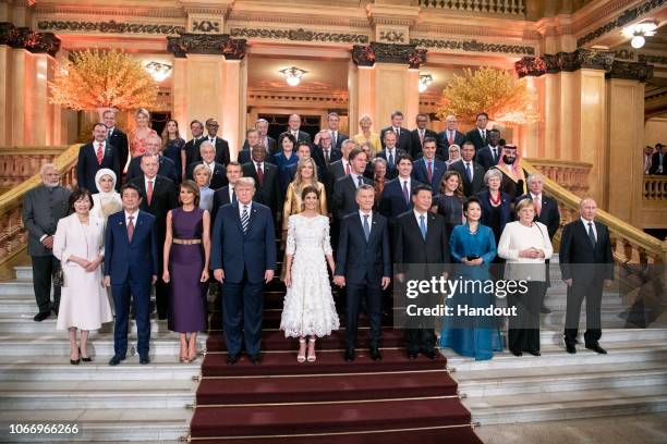 In this handout photo provided by the German Government Press Office , Japan's Prime Minister Shinzo Abe and his wife Akie, US President Donald Trump...