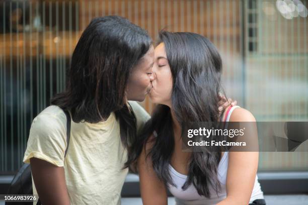 cute couple kissing - asian lesbians kiss stock pictures, royalty-free photos & images