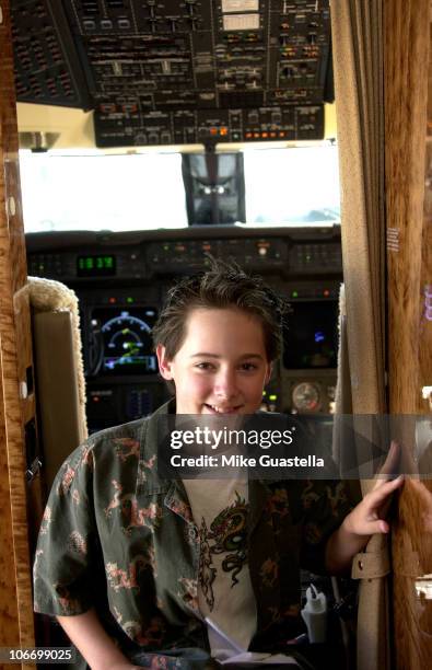 Jake Thomas makes a visit to view the cockpit during Traveling with Jake Thomas to Join Other Stars Participating in The Reebok '03 Heroes Celebrity...