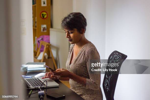 Woman working at desk with computers