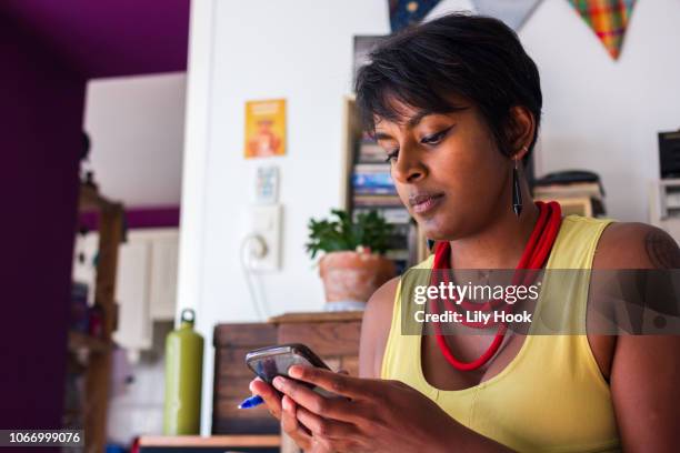 woman using phone - showus phone stock pictures, royalty-free photos & images