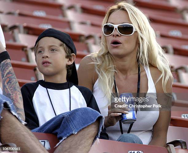 Pamela Anderson and son, Brandon Thomas, watch the X Games - Moto X Freestyle competition at the AL Coliseum in Los Angeles, Calif. On Saturday...