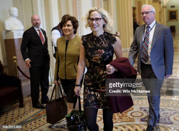 Newly-elected Democratic senators-elect Kyrsten Sinema and Jacky Rosen walk to the office of Senate Minority Leader Chuck Schumer for a meeting at...