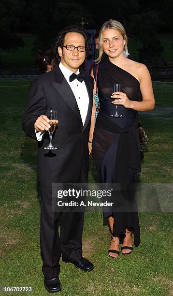 Rob Schneider and guest during The 22nd Annual Napa Valley Wine Auction "Cirque du Vin: Revelry in the Vineyards" at Meadowood Napa Valley in St....