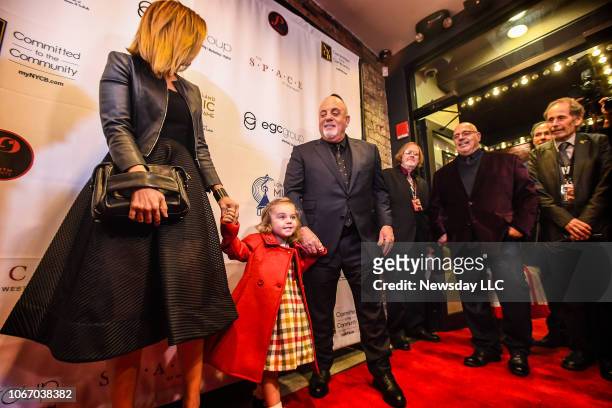 Billy Joel with his wife Alexis Roderick and daughter Della Rose on the red carpet during the Long Island Music Hall of Fame Gala at the Space at...
