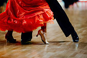 dance sports couple red dress black suit tail