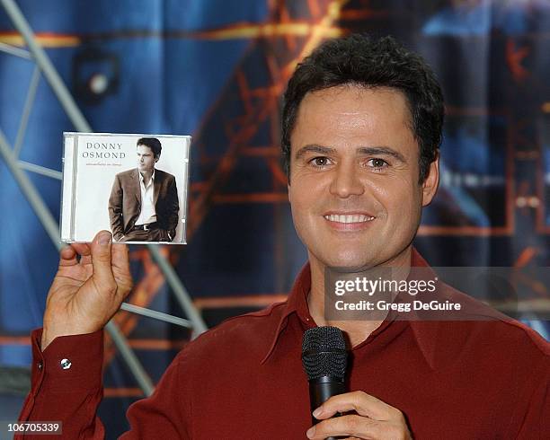 Donny Osmond holds up a copy of his new CD which will be released soon