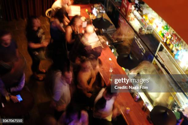 high angle, long exposure bar scene hanoi, vietnam - hanoi bar stock pictures, royalty-free photos & images