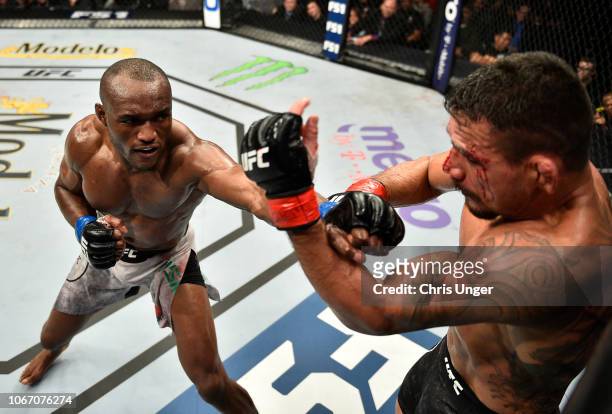 Kamaru Usman of Nigeria punches Rafael Dos Anjos of Brazil during The Ultimate Fighter Finale event inside The Pearl concert theater at Palms Casino...