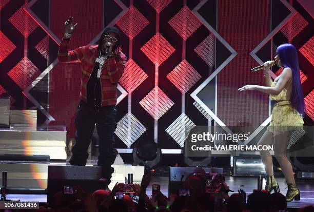Rapper Cardi B and her husband rapper Offset perform onstage during the KIIS FM's iHeartRadio Jingle Ball 2018 at the Forum Los Angeles in Inglewood...