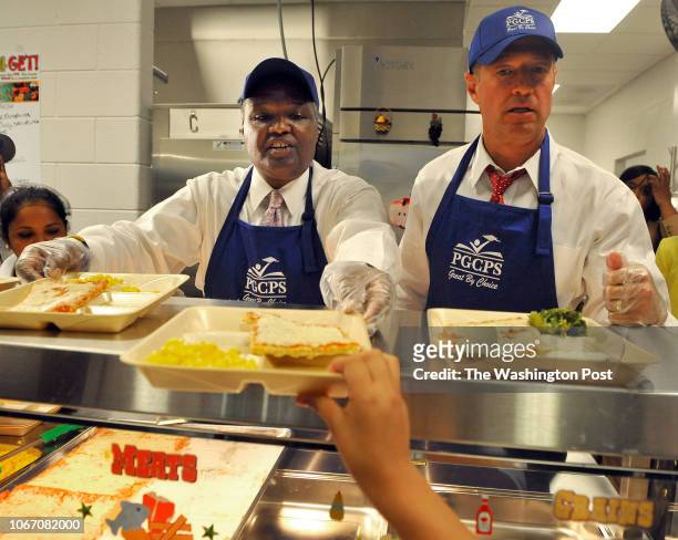 Prince Georges County County Executive Rushern L. Baker, III and Maryland Governor Martin O'Malley served a slice of cheese pizza, corn and broccoli...
