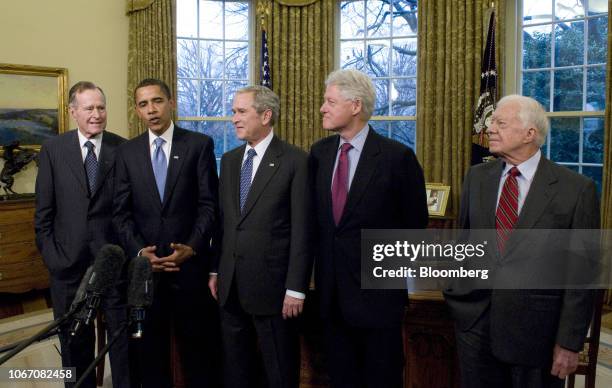President George W. Bush, center, meets with U.S. President-elect Barack Obama, second from left, and former U.S. Presidents George H.W. Bush, far...