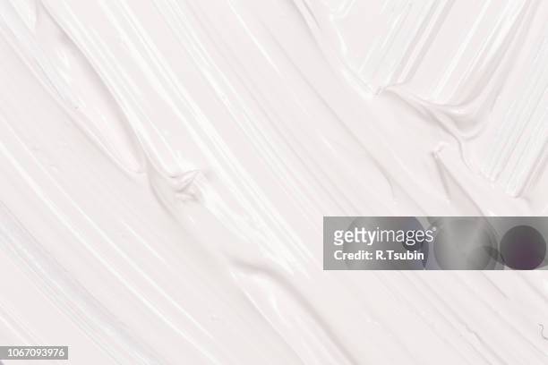 hand made oil paint brush stroke over the white paper as a design element of a backdrop - jogurt textur stock-fotos und bilder
