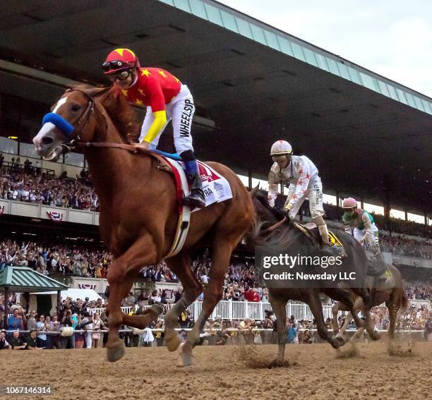 Elmont, N.Y. Justify winning the Triple Crown under jockey Mike Smith during the 150th Running of the Belmont Stakes at Belmont Park in Elmont, New...