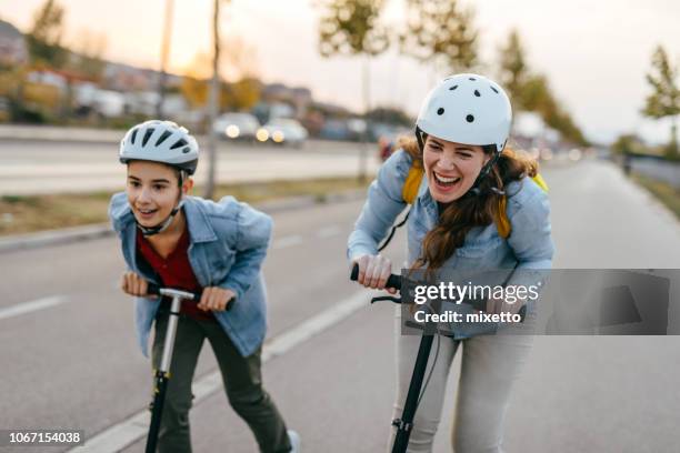 playful family - trotinete imagens e fotografias de stock