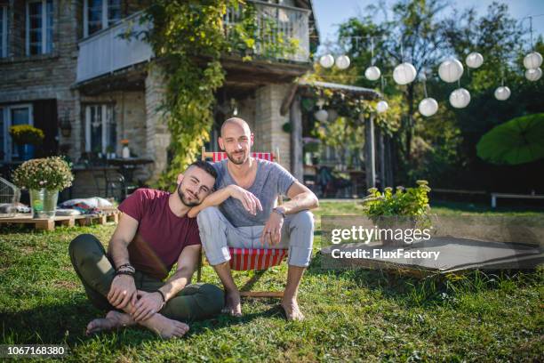 serene gay couple in love - beautiful gay men stock pictures, royalty-free photos & images