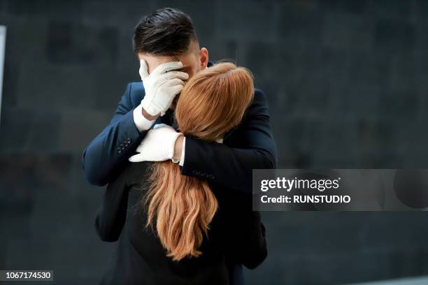 Crying Man Hugging Woman High-Res Stock Photo - Getty Images