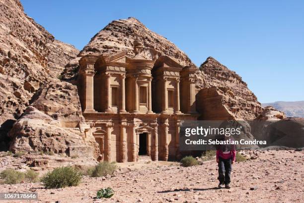 girl traveller at ruin on the the monastery el deir nabataean ancient town petra, jordan - hot arabic girl stock pictures, royalty-free photos & images