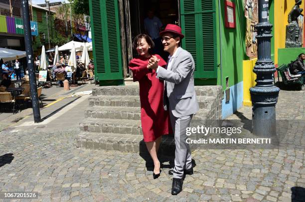 Japan's Prime Minister's wife Akie Abe dances tango during her visit at La Boca neighbourhood in Buenos Aires on the sidelines of the G20 Summit, on...