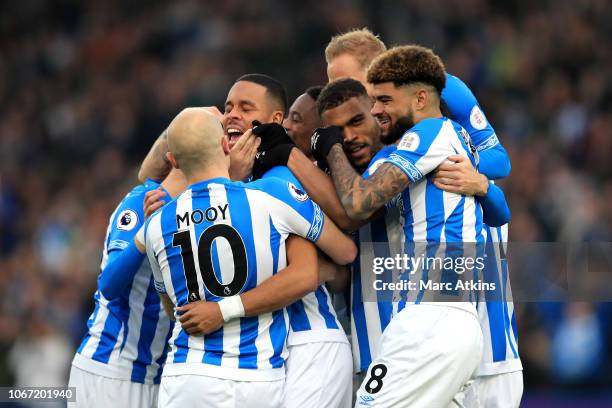 Mathias Zanka Jorgensen of Huddersfield Town celebrates with teammates after scoring his team's first goal during the Premier League match between...