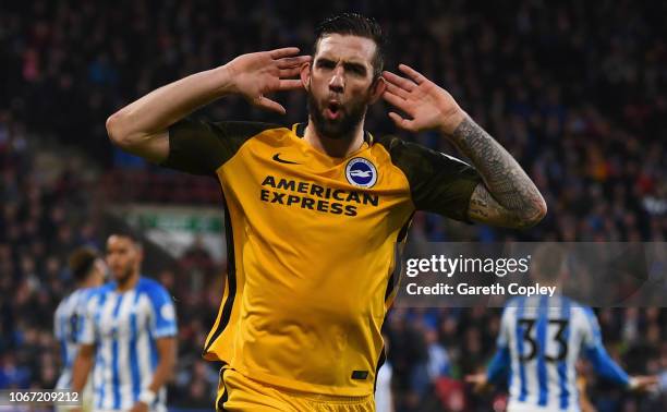 Shane Duffy of Brighton and Hove Albion celebrates after scoring his team's first goal during the Premier League match between Huddersfield Town and...