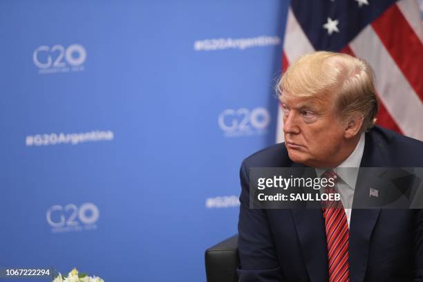 President Donald Trump gestures during a bilateral meeting with Germanys Chancellor Angela Merkel, on the sidelines of the G20 Leaders' Summit in...