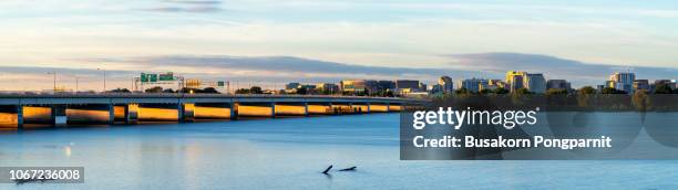 washington dc panorama with bridges across potomac river at sunset - washington dc summer stock pictures, royalty-free photos & images