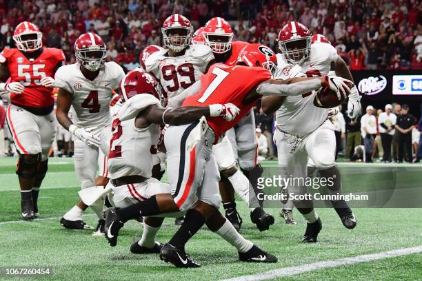 Andre Swift of the Georgia Bulldogs rushes for a 9-yard touchdown in the second quarter against the Alabama Crimson Tide during the 2018 SEC...