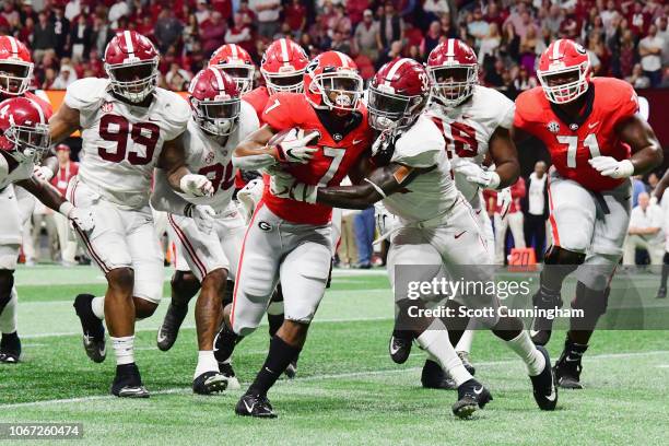 Andre Swift of the Georgia Bulldogs rushes for a 9-yard touchdown in the second quarter against the Alabama Crimson Tide during the 2018 SEC...