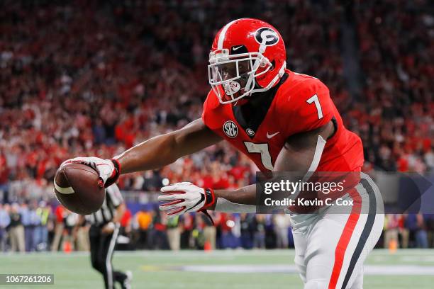 Andre Swift of the Georgia Bulldogs scores an 11-yard receiving touchdown in the second quarter against the Alabama Crimson Tide during the 2018 SEC...