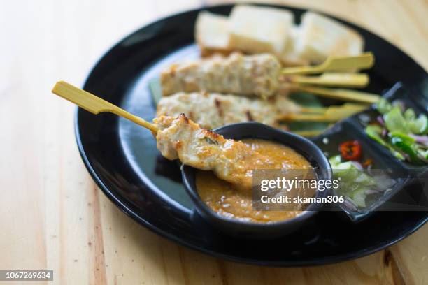 chicken satay grilled on plate - satay stock pictures, royalty-free photos & images