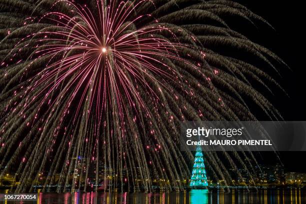 Fireworks are seen during the inauguration ceremony of a 70-meter-high Christmas Tree at Rodrigo de Freitas Lagoon in Rio de Janeiro, Brazil, on...