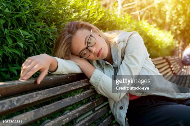 depression in women - unhappy woman blonde glasses stock pictures, royalty-free photos & images