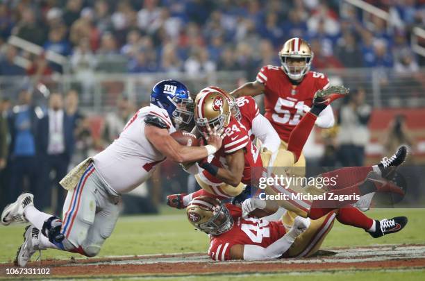 Waun Williams of the San Francisco 49ers dive for a batted ball along with Spencer Pulley of the New York Giants during the game at Levi's Stadium on...