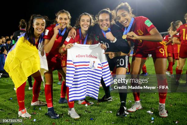 Spain players hold a shirt advertising the Womens World Cup France 2019 after winning the FIFA U-17 Women's World Cup Uruguay 2018 final match...