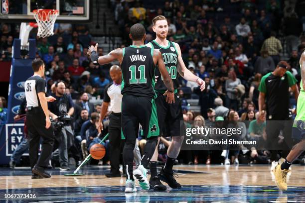Kyrie Irving greets Gordon Hayward of the Boston Celtics during the game against the Minnesota Timberwolves on December 1, 2018 at Target Center in...