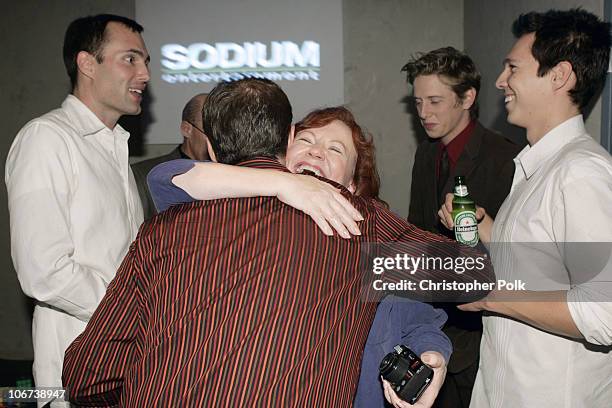 Edie McCurg hugs producer Brady Nasfell, center, James Haven, left, and director Mark Edwin Robinson, right.