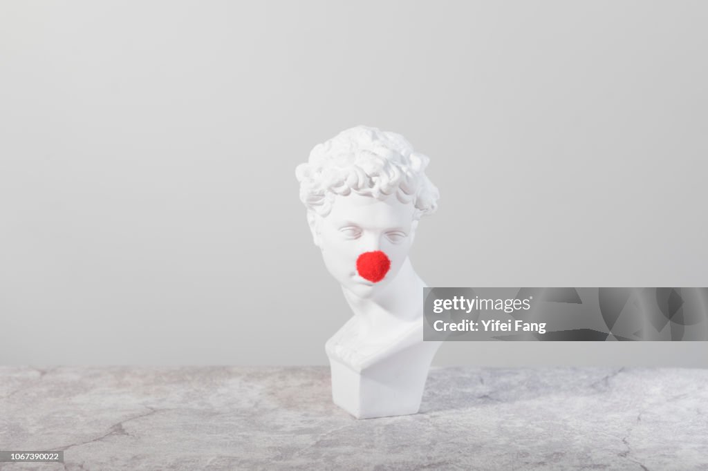 Head sculpture with red nose