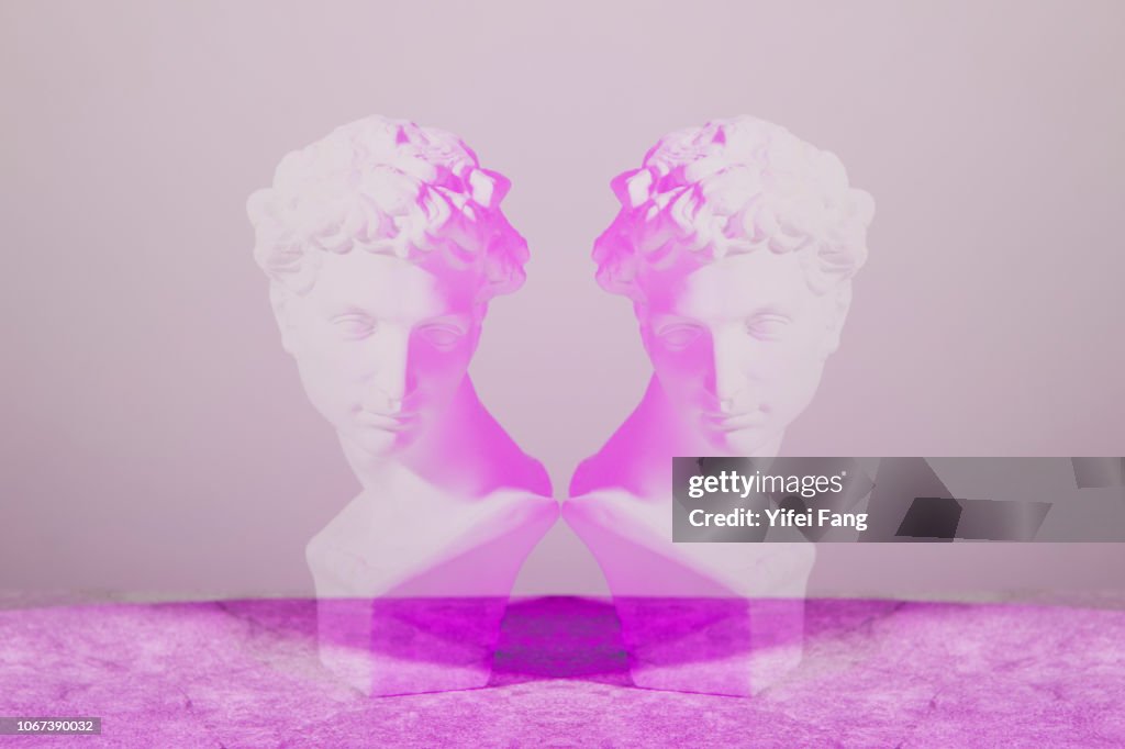Mirrored image of sculpture facing each other