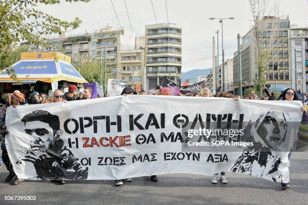 Protesters are seen holding a banner during a protest in Memory of Zak Kostopoulos a 32 year old LGBT HIV activist who was murdered in central Athens...