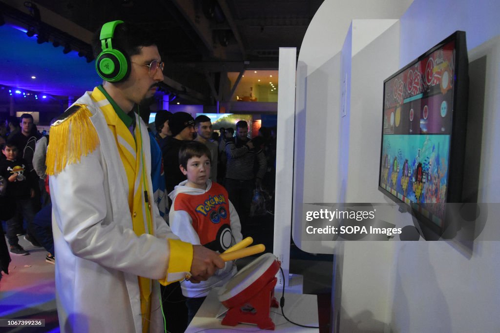 A man seen playing a video game  during the Barcelona Games...