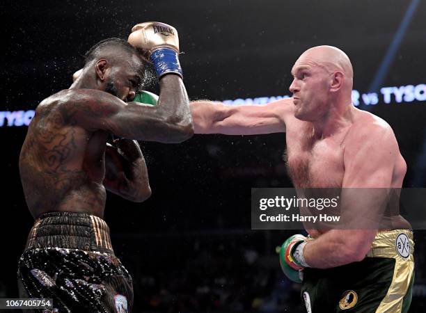 Tyson Fury punches Deontay Wilde in the seventh round fighting to a draw during the WBC Heavyweight Championship at Staples Center on December 1,...
