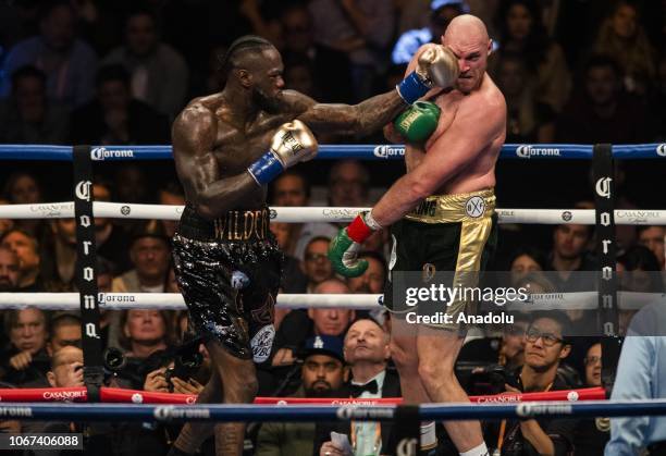 Deontay Wilder lands a left hand against Tyson Fury during the Showtime WBC Heavyweight Championship at the Staples Center in Los Angeles, California...