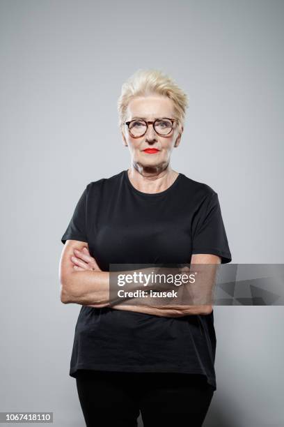 portrait of confident senior woman - angry protestor stock pictures, royalty-free photos & images