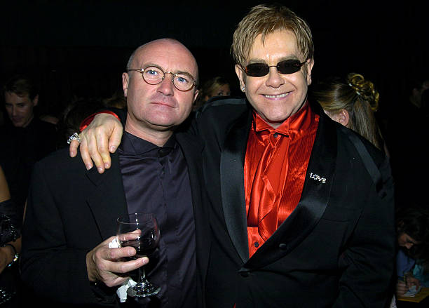 Phil Collins and Elton John during 12th Annual Elton John AIDS Foundation Oscar Party Co-hosted by In Style - Inside at Pearl in West Hollywood,...