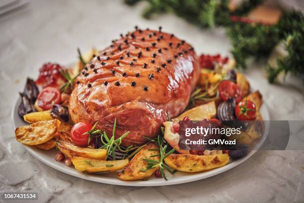 christmas dinner with glazed holiday ham with cloves and vegetables - glazed ham imagens e fotografias de stock