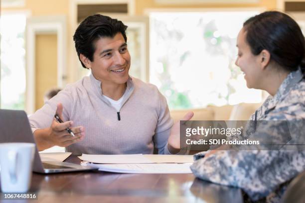 couple review financial documents - military spouse stock pictures, royalty-free photos & images