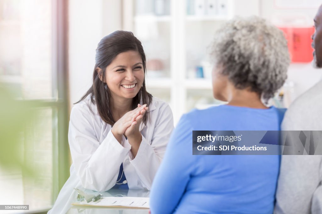 Female doctor enjoys giving patients good news